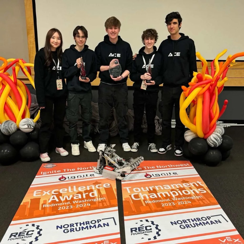 ACE with Excellence Award and Tournament Champion banners in Redmond
